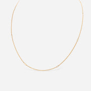 Kate & Mimi 18K yellow gold diamond necklace with alternating single diamond set in bezel setting and double diamond bezels