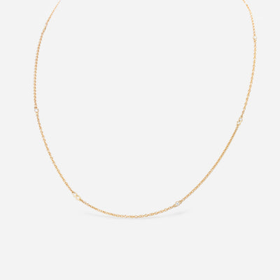 Kate & Mimi 18K yellow gold diamond necklace with alternating single diamond set in bezel setting and double diamond bezels