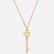Kate & Mimi Mini Love Key with single round diamond on one side and round diamonds set pavé style on the other side front view with chain